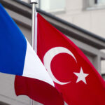 The French and Turkish flags flutter outside the Turkish prime minister's office in Ankara on January 27, 2014. French President Francois Hollande arrived in Turkey for a state visit amid a political crisis plaguing the Turkish government and turmoil roiling his private life. AFP PHOTO/ ALAIN JOCARD